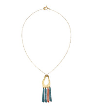 Nihira Necklace - gold pendant w teal red fringe